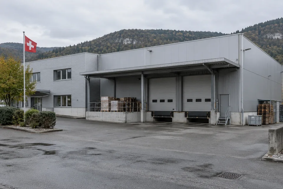Illustration of an industrial depot in a Swiss setting